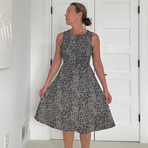Philosophy A-line dress with modern print and zipper back.